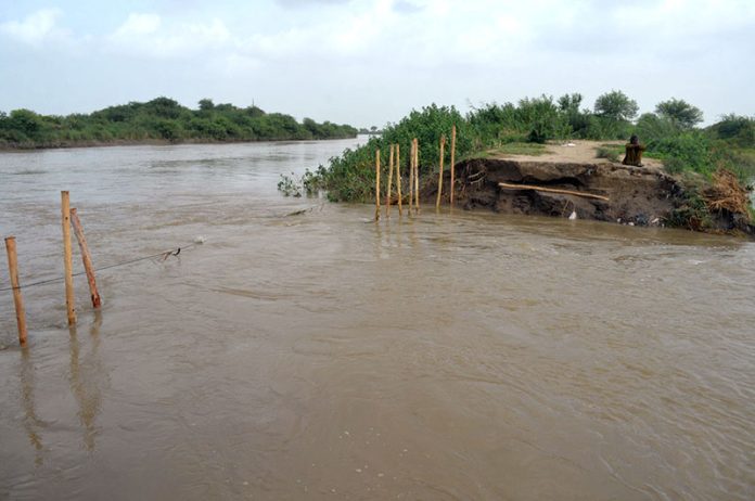 A view after a crack in the Phuleli Canal allowed water to flood agricultural fields in Norai village near Seri