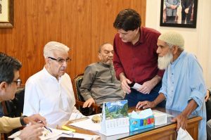 Defense Minister Khawaja Muhammad Asif listens to public concerns during a meeting at his residence