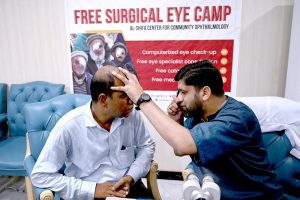 Doctors examine patients’ eyes during a free surgical eye camp organized by Al-Shifa Trust Eye Hospital at the National Press Club