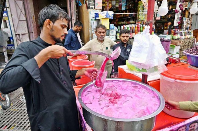 A street vendor sells a traditional chilled summer drink at Pakistan Chowk, offering some relief to citizens battling the intense heatwave