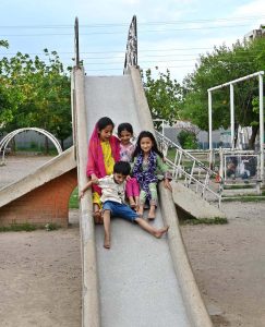 Children enjoy swings at G-7 Local Park in the Federal Capital