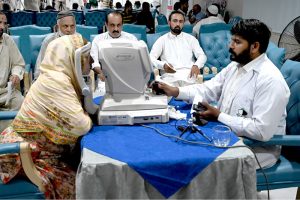 Doctors examine patients’ eyes during a free surgical eye camp organized by Al-Shifa Trust Eye Hospital at the National Press Club