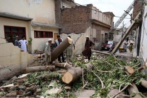 A view of a collapsed house wall at Qazi Town, which brought down a transformer and electric poles during yesterday’s rainfall.