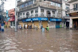 A heavy downpour measuring 97 millimetres disrupts daily life in the city, as roads are inundated with rainwater during the second spell of the monsoon at Tehsil Road Furniture Market in Chiniot