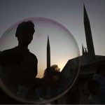 A vendor makes bubbles to attract the children visiting the famous Faisal Masjid during evening time in Federal Capital