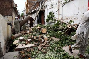 A view of a collapsed house wall at Qazi Town, which brought down a transformer and electric poles during yesterday’s rainfall.