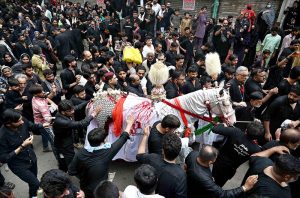 A large number of mourners attending the procession of 9th Muharram-ul-Haram. Muharram ul Harram known as the first month of the Islamic calendar and the mourning month in remembrance of the martyrdom (Shahadat) of Hazrat Imam Hussain (AS), the grandson of the Holy Prophet Mohammad (SAWW)