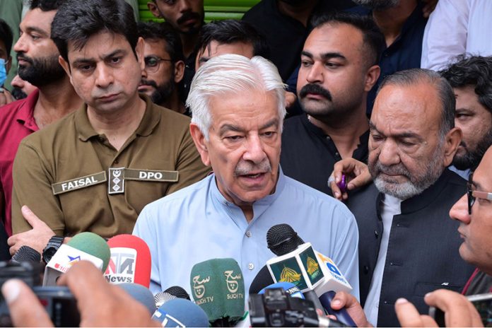 Defense Minister Khawaja Muhammad Asif is talking to media personnel on the occasion of visiting the main procession of the 10th of Muharram, Ashura Day