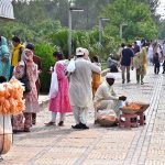 Vendors display edible items to attract visitors outside Faisal Masjid in the Federal Capital