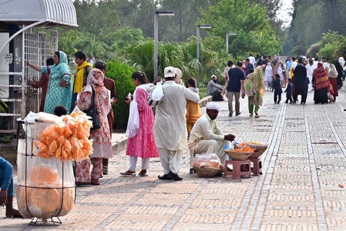 Vendors display edible items to attract visitors outside Faisal Masjid in the Federal Capital