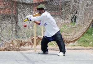 Player in action during a trial for the National Physically Disabled Cricket Championship at Sports ground.