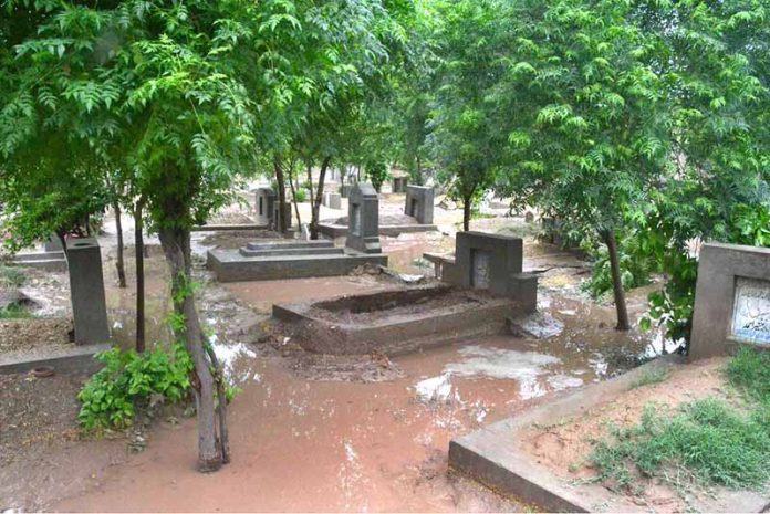 Heavy monsoon rains caused flash floods at Pir Yaqub Cemetery on Jhang Road, damaging several graves