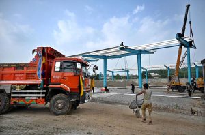 Laborers are busy constructing sheds for buses at the charging station in H-8, as part of the Capital Development Authority's (CDA) project to expand the city’s electric bus network.