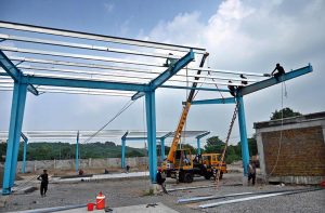 Laborers are busy constructing sheds for buses at the charging station in H-8, as part of the Capital Development Authority's (CDA) project to expand the city’s electric bus network.