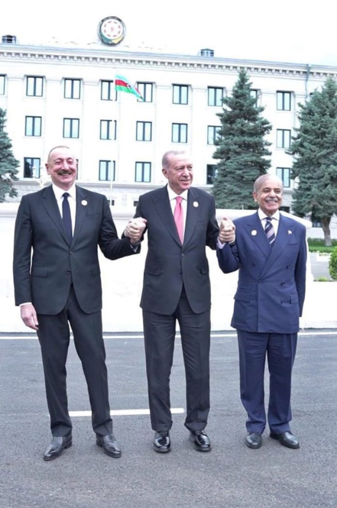 Prime Minister Muhammad Shehbaz Sharif, President of Turkiye Recep Tayyip Erdogan and President of Azerbaijan Ilham Aliyev holding hands in solidarity showing the strong brotherly ties between the three countries after the conclusion of 17th ECO Summit