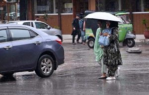 A traffic warden removing a wrong side parked car with help of fork lifter on 6th Road.