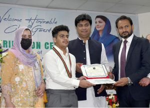 Commissioner Amir Karim Khan, along with Deputy Commissioner Waseem Hamid Sindhu, presses a button to officially launch the 10th class annual results online