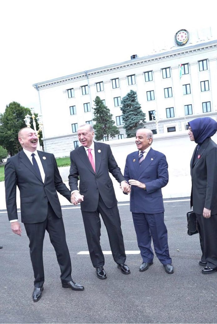 Prime Minister Muhammad Shehbaz Sharif, President of Turkiye Recep Tayyip Erdogan and President of Azerbaijan Ilham Aliyev holding hands in solidarity showing the strong brotherly ties between the three countries after the conclusion of 17th ECO Summit