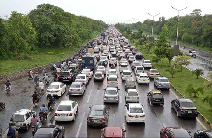 A view of traffic Jam on Islamabad Express Way after rain in the twin city