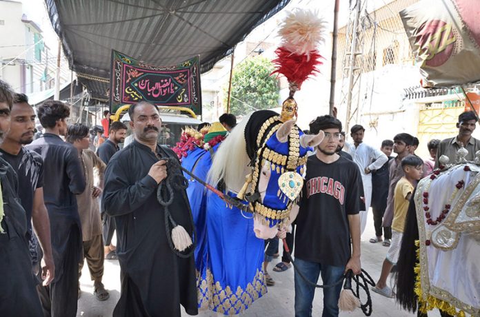Mourners attending procession of 9th Muhrramul Harram at Latifabad