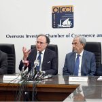 Finance Minister Senator Muhammad Aurangzeb Talking to Media Persons during visiting overseas Investors Chamber of Commerce & Industry (OICCI) at here.