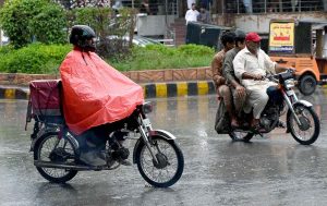 A traffic warden removing a wrong side parked car with help of fork lifter on 6th Road.