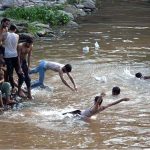 Youngsters swimming in Rawal Lake Spillway stream to get relief of the hot humid weather in the federal capital. The district administration has imposed section 144 due to heavy rain spell and risk of flood in the streams