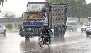 A view of traffic Jam on Islamabad Express Way after rain in the twin city