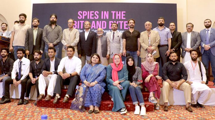 Former Air Chief Marshal Sohail Aman, Dr. Atif Ali, and others pose for a group photo at the conclusion of the ceremony held to mark the launch of Dr. Atif Ali's book