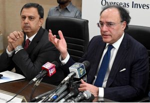 Finance Minister Senator Muhammad Aurangzeb Talking to Media Persons during visiting overseas Investors Chamber of Commerce & Industry (OICCI) at here.