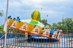 Visitors enjoy camel ride at Rawal Lake View Park during a pleasant weather after downpour that experienced throughout the day in the federal capital.