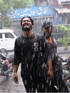 Youngsters enjoy the pleasant weather and rain in the Provincial Capital.