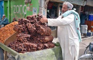 A vendor sells Dried Plums (Alu Bukhara) mostly uses in summer drinks in hot weather.
