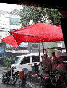 Youngsters enjoy the pleasant weather and rain in the Provincial Capital.