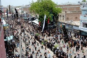 A large number of people beating themselves with chained Knives in a mourning procession of 9th Muharam ul Harm to commemorate the martyrdom of Hazrat Imam Hussain (RA), the grandson of Prophet Muhammad (PBUH) at Mumtazabad