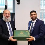 Federal Minister for Commerce Jam Kamal Khan presents a souvenir to UK Minister Lord Wajid Khan during their meeting in London — the two discussed enhancing bilateral trade, investment, and cooperation in urban development.