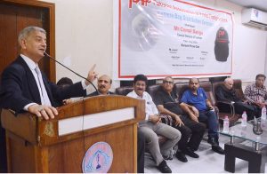 Turkish Counsel General Cemal Sangu addresses the bag distribution ceremony organized by the Pakistan Association of Press Photographers (PAPP) at the Karachi Press Club.
