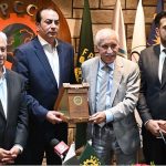President FPCCI & ECO-CCI Atif Ikram Sheikh presents a shield to Federal Minister for Investment Qaiser Ahmed Sheikh during the Interactive Session on "Economic Integration between Pakistan-ASEAN Regions" at the FPCCI Capital House office in the Federal Capital