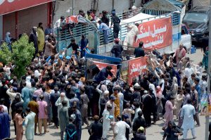 A large number of people beating themselves with chained Knives in a mourning procession of 9th Muharam ul Harm to commemorate the martyrdom of Hazrat Imam Hussain (RA), the grandson of Prophet Muhammad (PBUH) at Mumtazabad