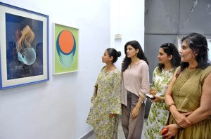 Female art lovers admire the artwork of Hasnat Mehmood on display at the Sanat Initiative gallery in provincial capital.