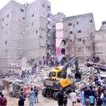 Heavy machinery is deployed for rescue operations after a residential building collapsed in Baghdadi, Lyari. Several people are feared dead and injured