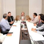 Chairman Prime Minister Youth Programme Rana Mashhood Ahmad Khan participates in a meeting during his visit to the National Incubation Center at NED University