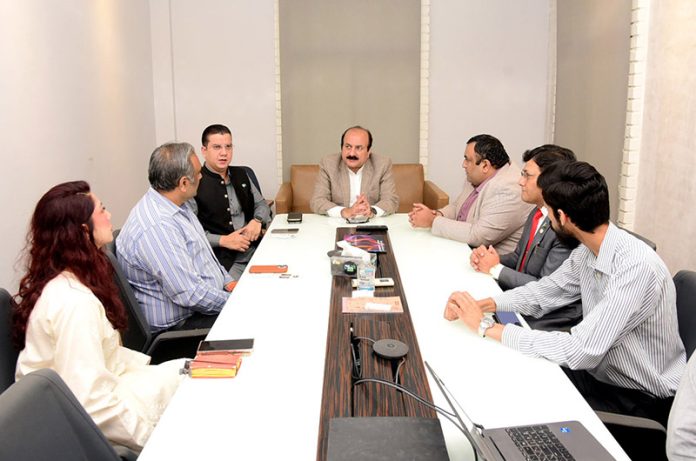 Chairman Prime Minister Youth Programme Rana Mashhood Ahmad Khan participates in a meeting during his visit to the National Incubation Center at NED University