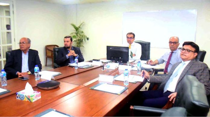 Adviser to the Prime Minister on Privatisation, Muhammad Ali chairing a meeting of the Privatisation Commission Board