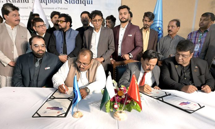 Officials signing after inauguration ceremony launch of china – Pakistan TEVT industrial center of excellence at HITMS