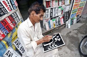 Despite the rise of digital systems, the painter remains devoted to the traditional art of brush and canvas