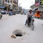 A view of an open manhole near the railway station may cause of any mishap, highlighting the need for attention from concerned authorities