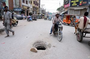A view of an open manhole near the railway station may cause of any mishap, highlighting the need for attention from concerned authorities