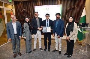 H. E. Hussain Muhammad, Consul General of Pakistan received the Certificate of Participation on behalf the Consulate for contributing to a new Guinness World Record, the largest UAE flag created using 24,514 human handprints.