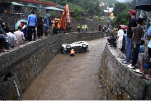 A view of damaged cars being recovered from a nullah in Saidpur Village due to flooding caused by heavy rainfall in the Federal Capital.